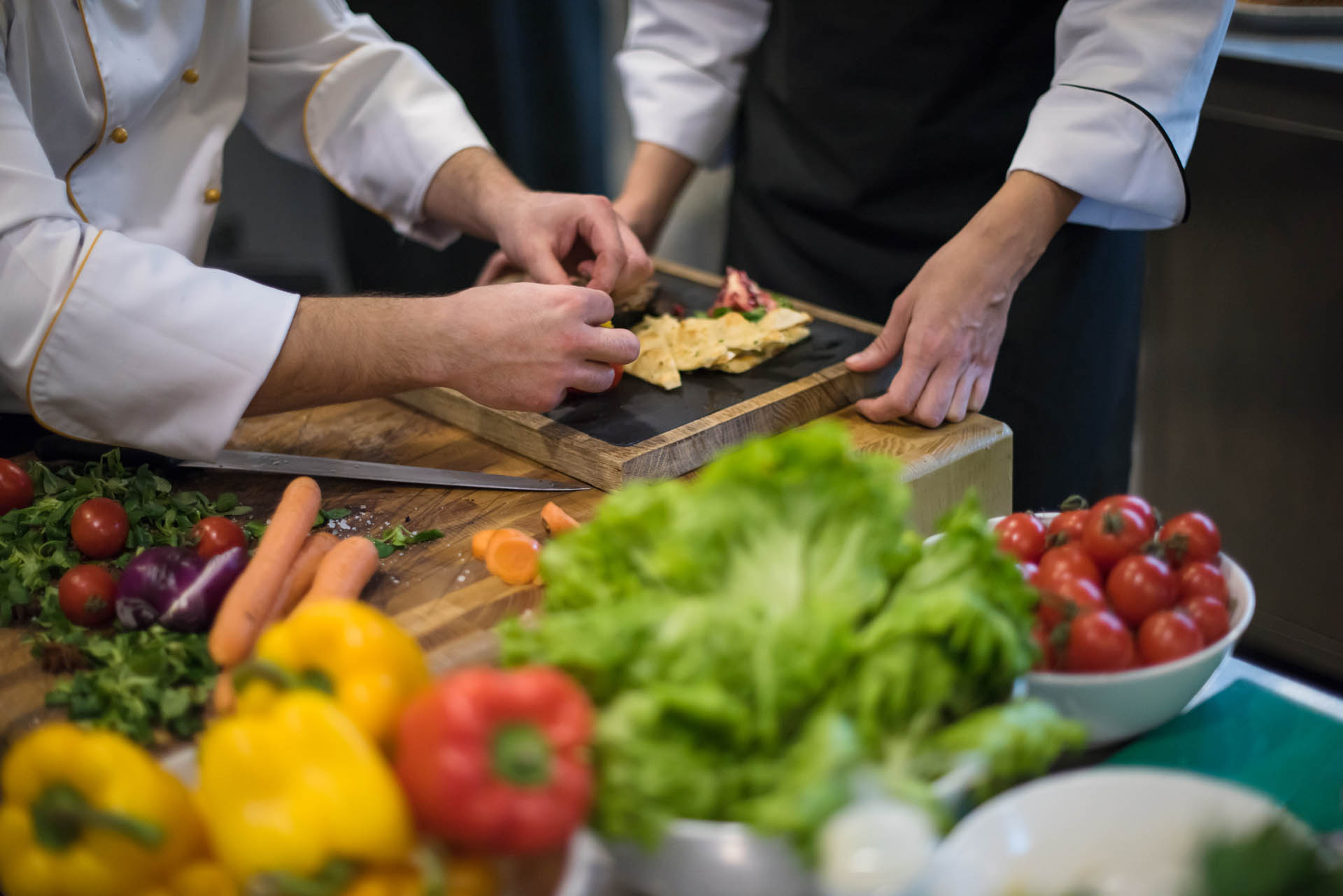 team cooks and chefs preparing meal